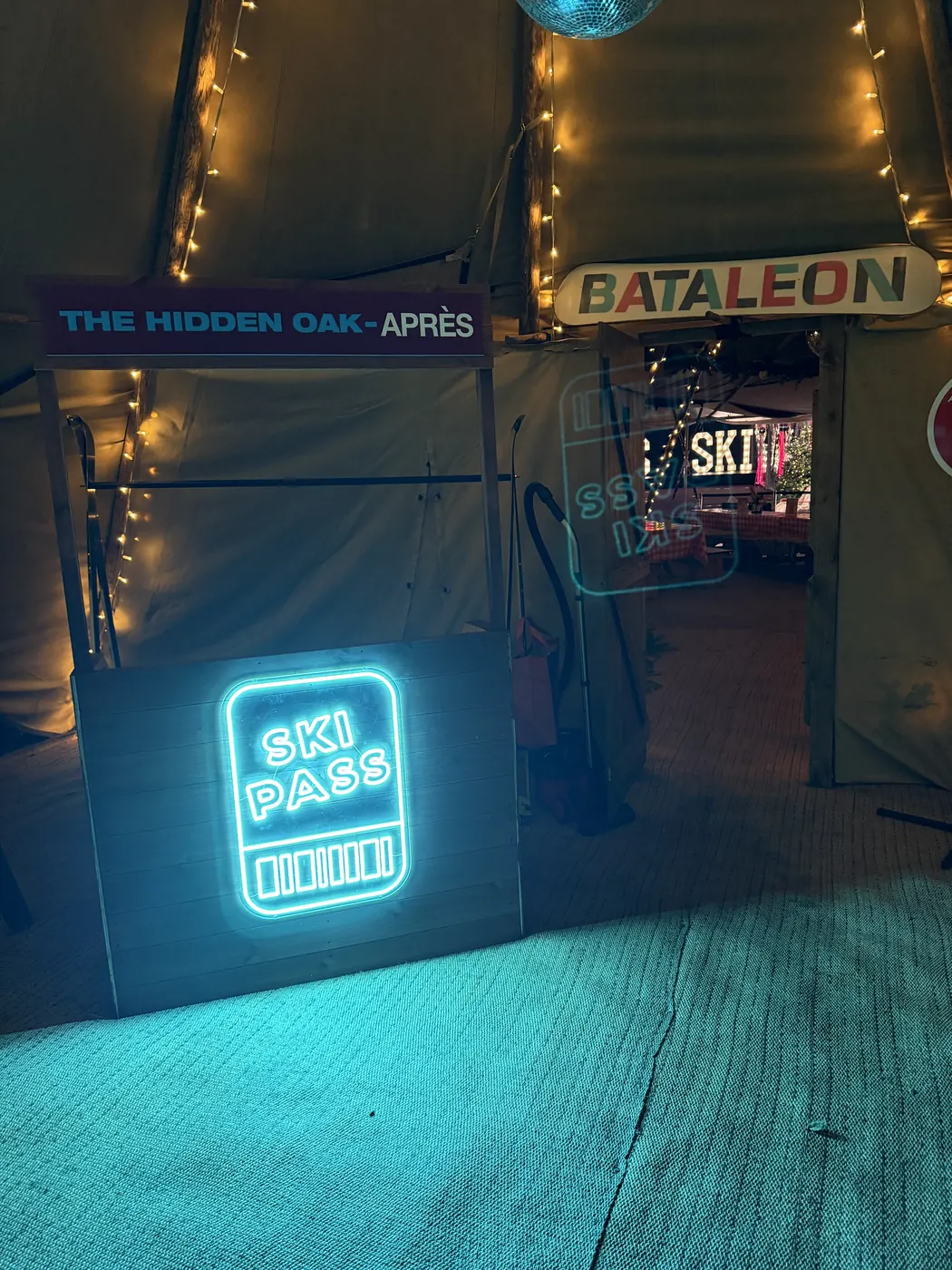 The ski-pass neon by the entrance