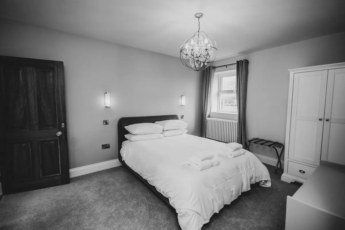 A guest bedroom in the farmhouse at The Hidden Oak.