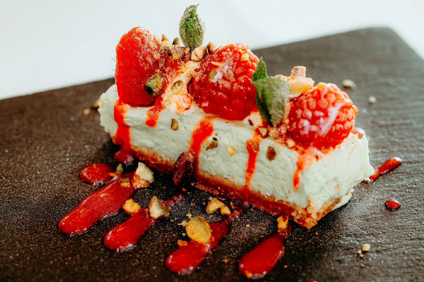 Cheesecake with raspberries and pistachio