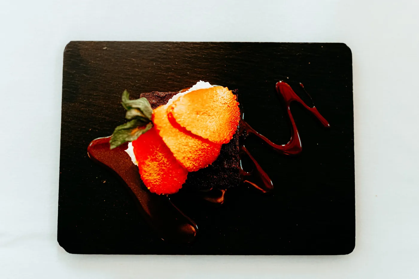 A plated dessert on slate