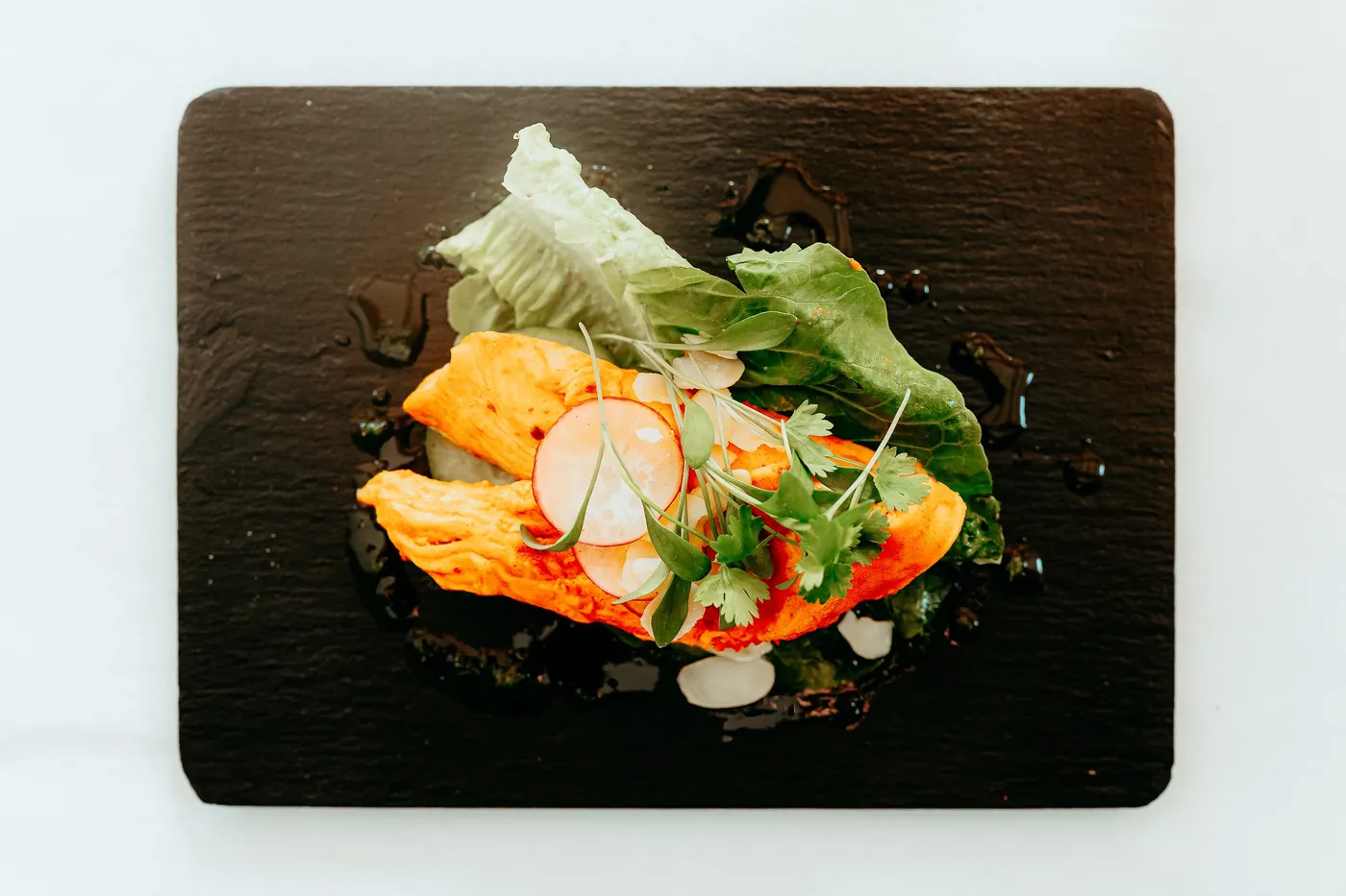 A salmon starter with radish and herbs