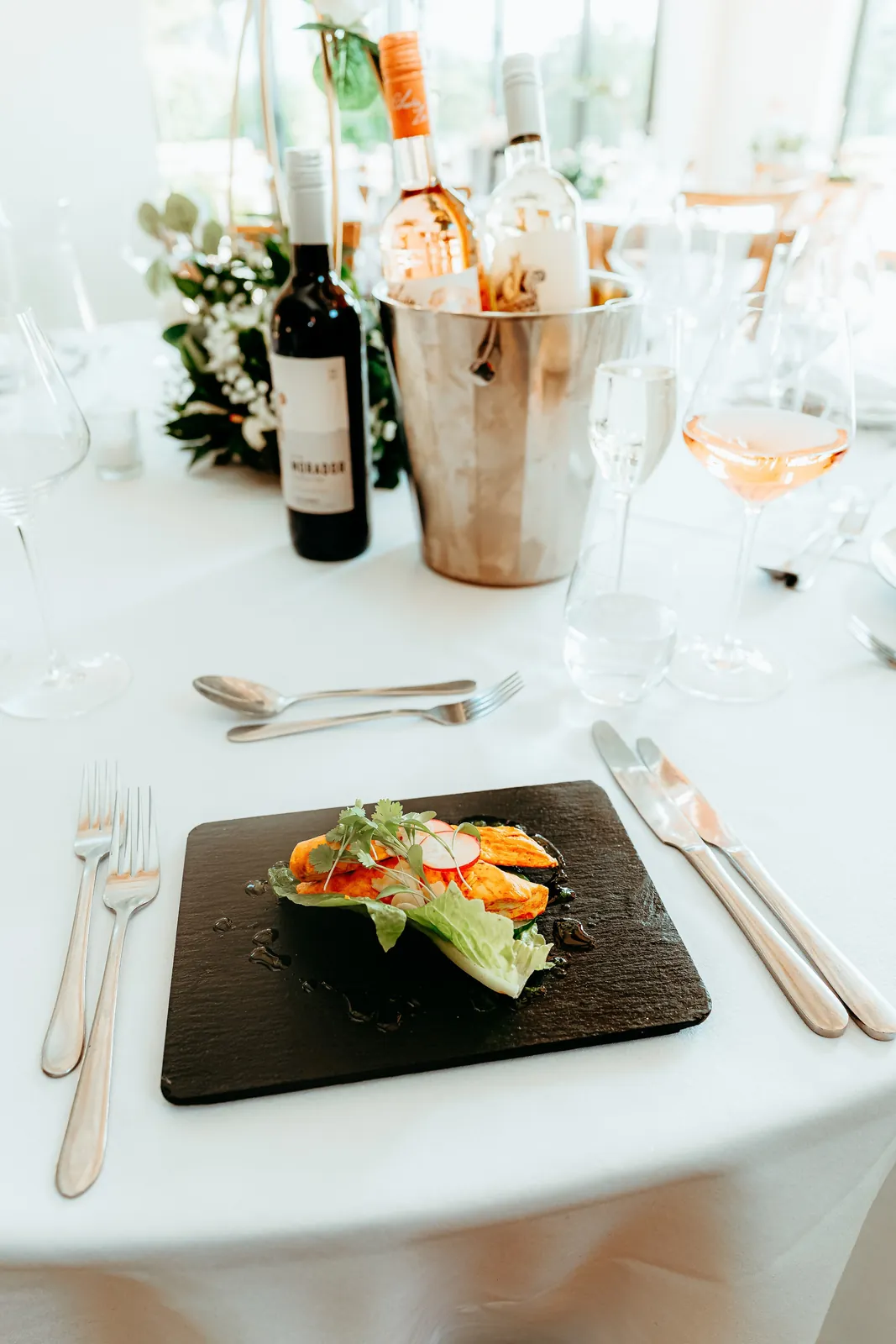 A starter served on slate at a laid table