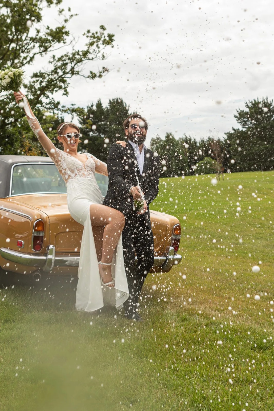 Confetti popped beside the car on the lawn