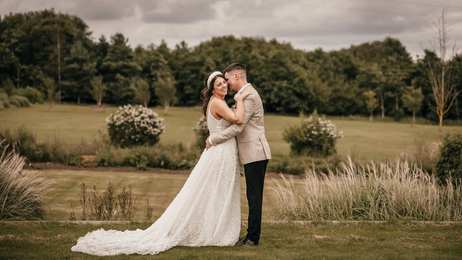 A couple embracing on the lawn