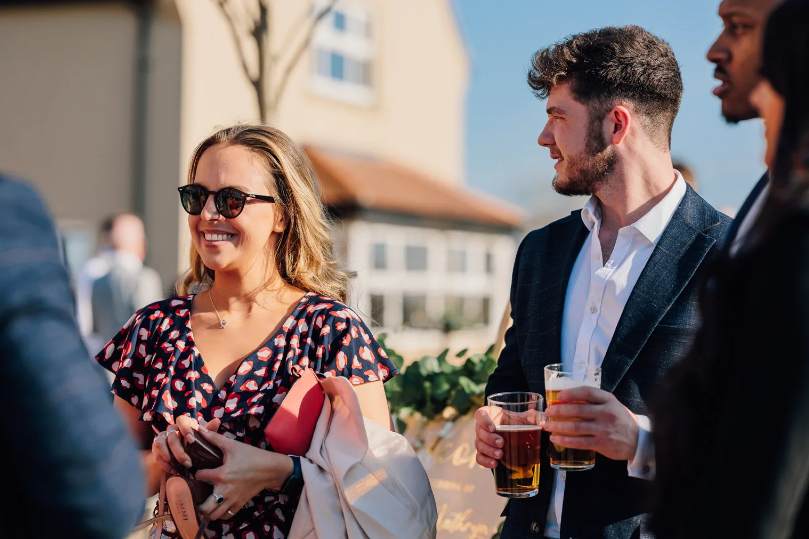 Guests laughing over drinks