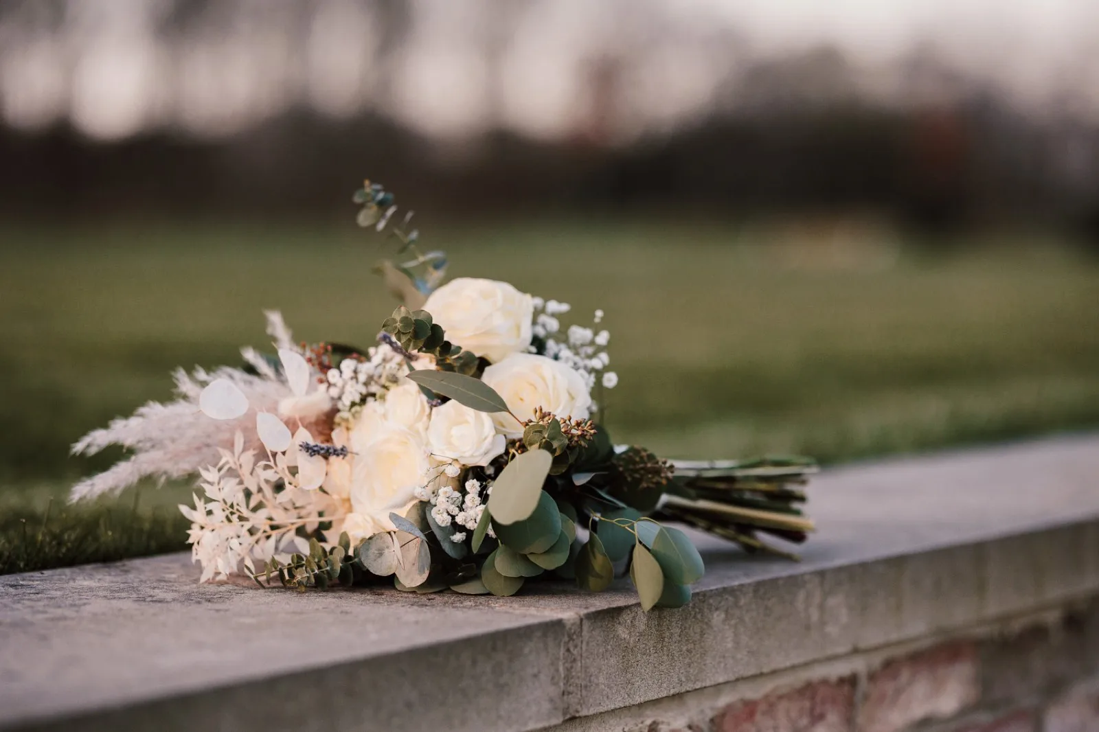 A bouquet resting on the wall
