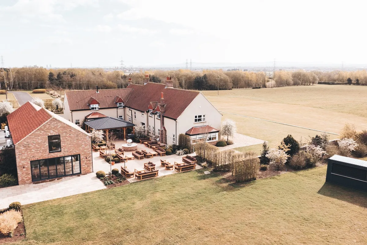 The landscaped grounds and woodland at The Hidden Oak.