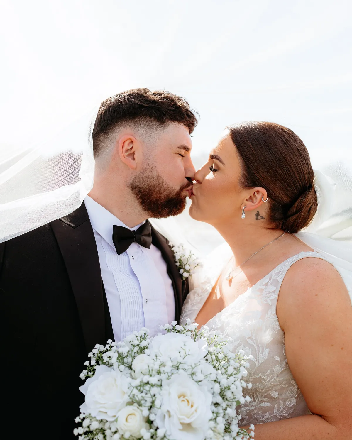 A couple on their wedding day in the grounds at The Hidden Oak.